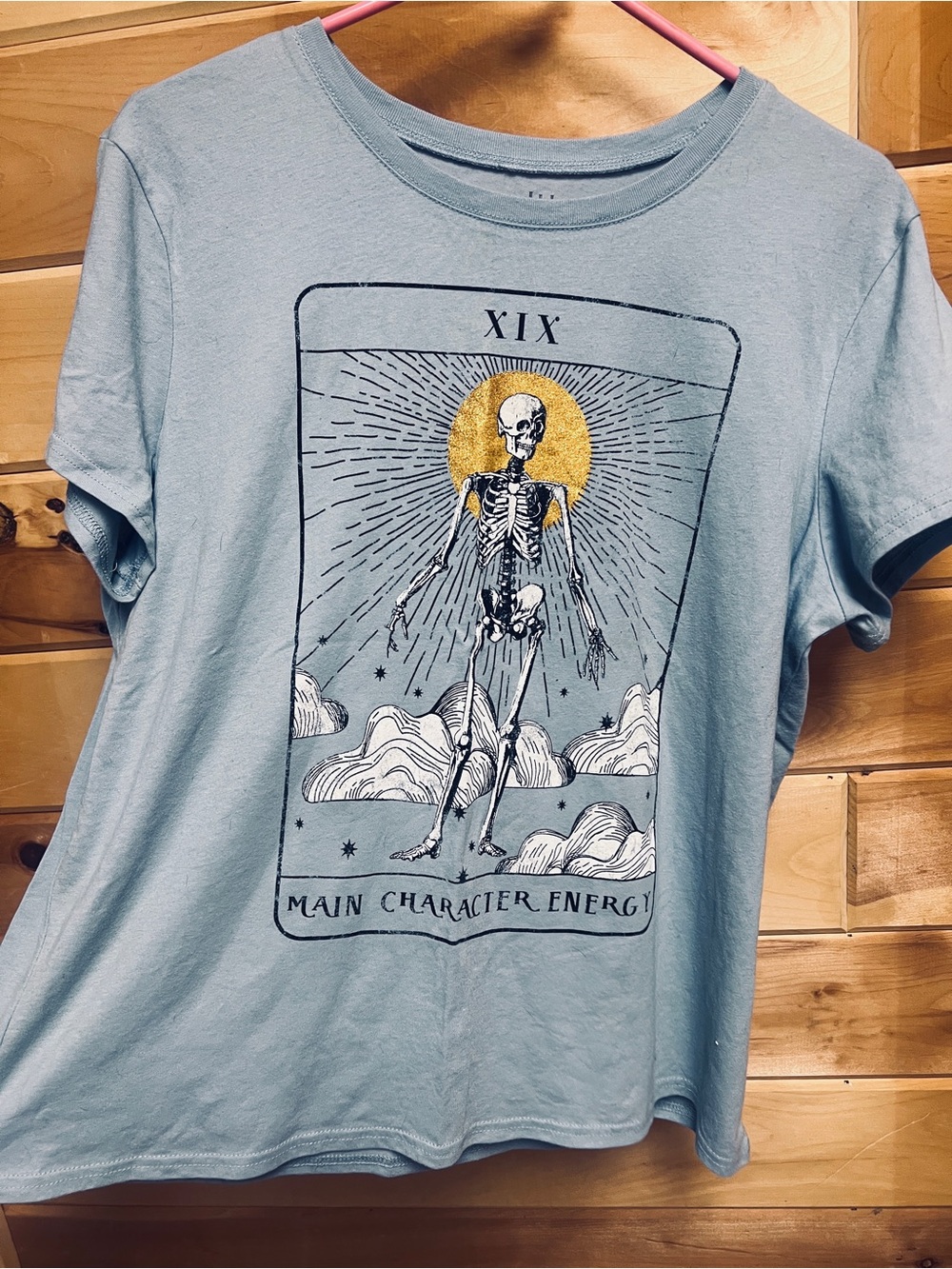 Wound Up Light Blue 'Main Character Energy' Graphic Tee with Gold Accent